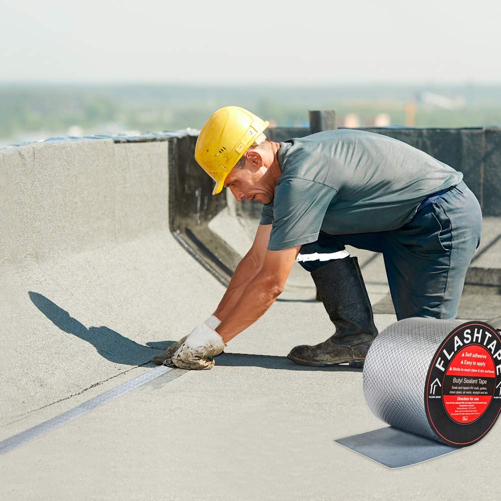 Rubber Roofing Contractor in Mount Airy, PA Rubber roofing repairs. Roofer inspecting the repaired roof and patching the minor issues